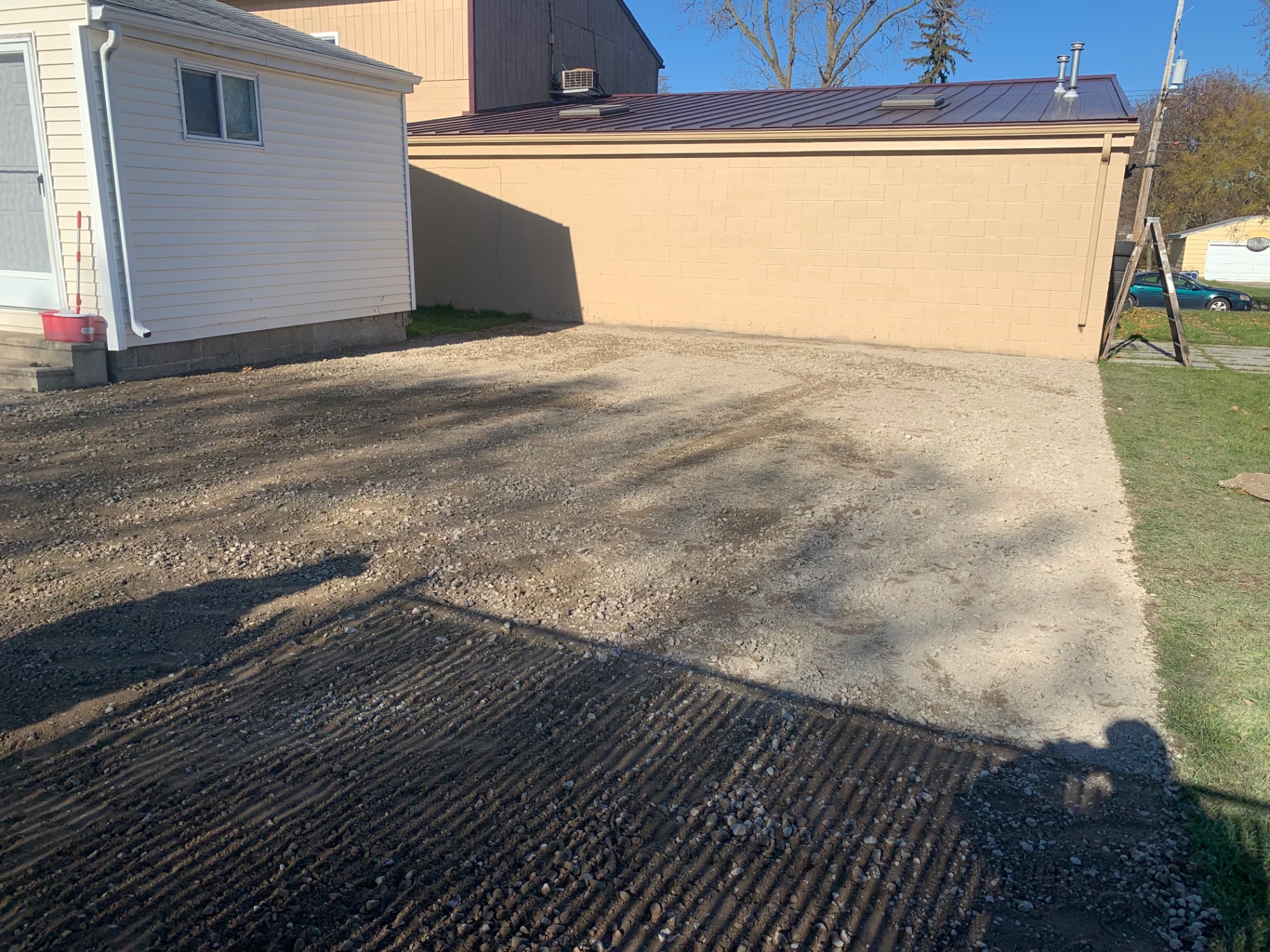 Freshly leveled gravel driveway pad